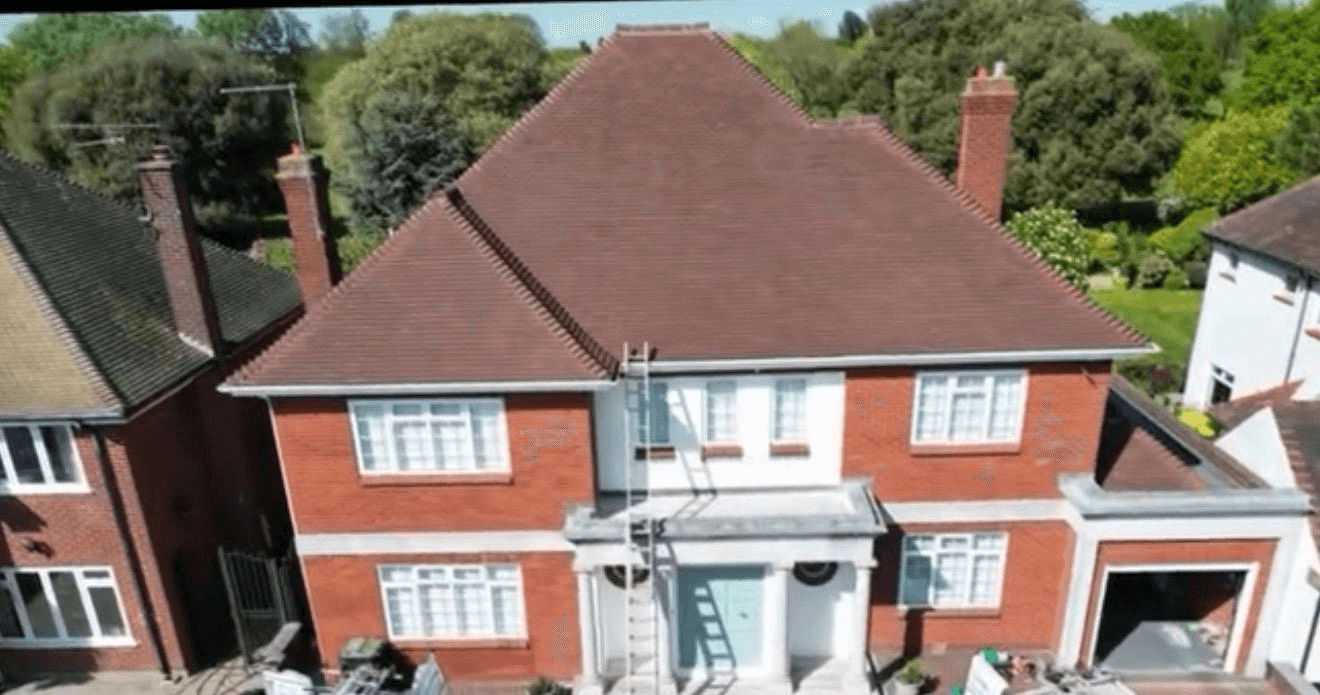 Same large detached house with fully restored clean terracotta tiles after cleaning